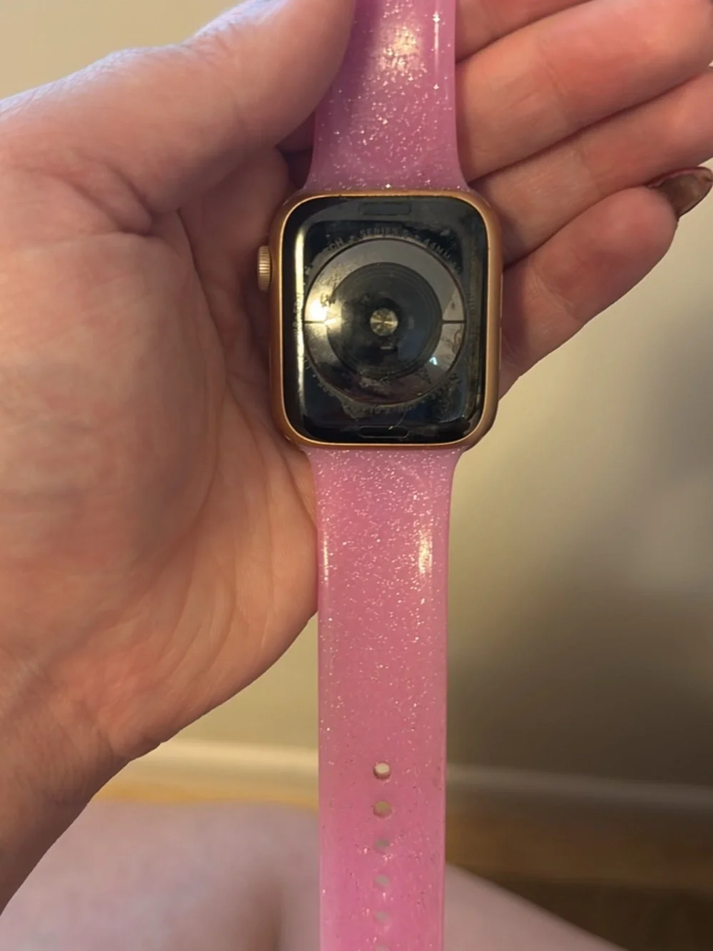 Apple Smartwatch with Pink Silicone Band and Black Display